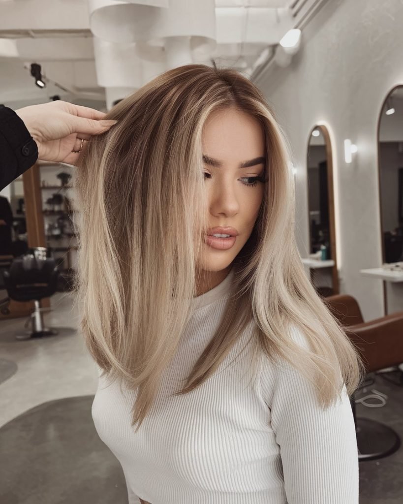 Mid-Length Blonde Balayage with Side Part